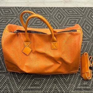 Tote & Carry Orange duffel bag. Used twice, great condition